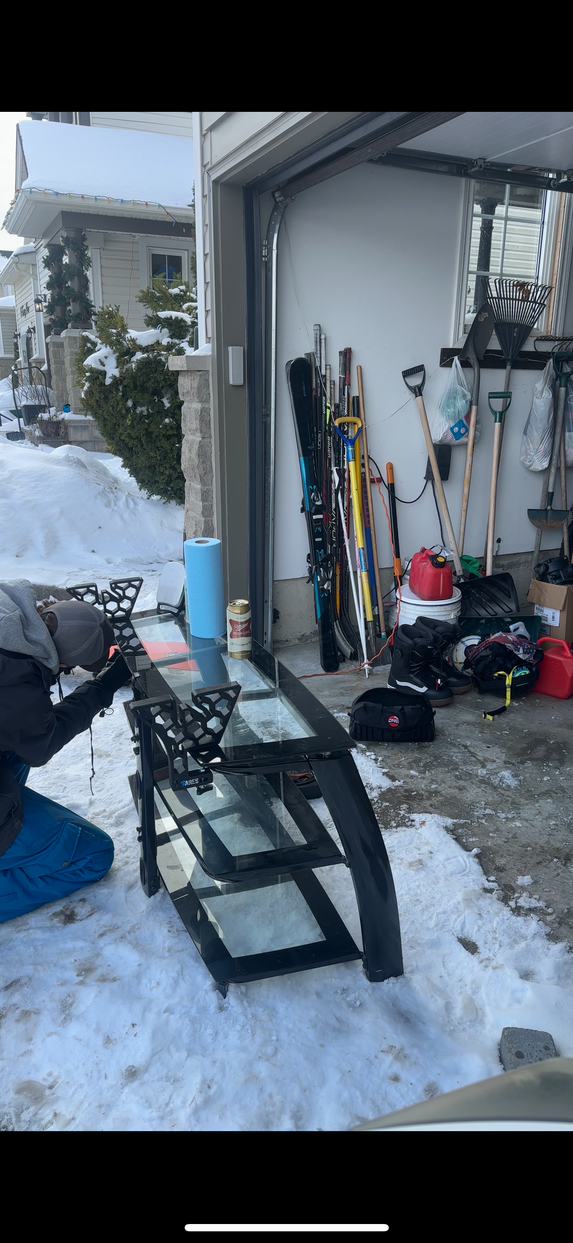 setting up ARES snowboard tuning and waxing stands out on the driveway in a Canadian winter