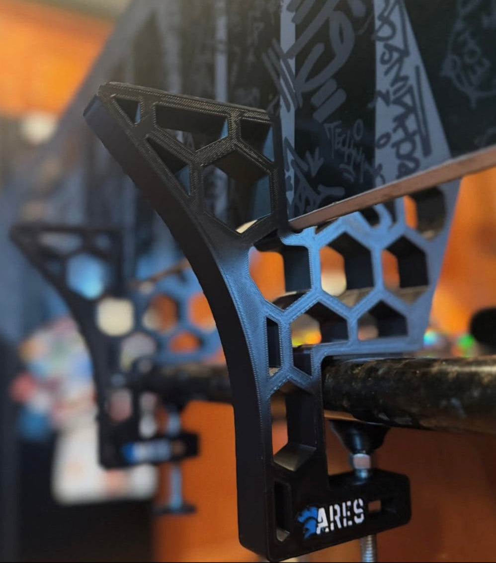 Close up of the ARES snowboard Tuning and waxing stand being used on the kitchen table