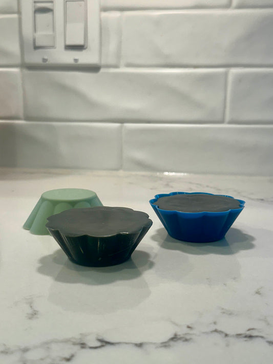 eco snowboarding wax made from hemp, beeswax, carnauba wax and graphite in a silicone mold on a countertop