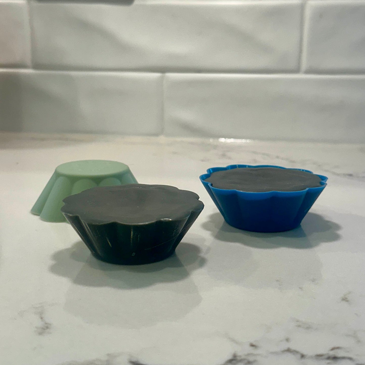 eco snowboarding wax made from hemp, beeswax, carnauba wax and graphite in a silicone mold on a countertop